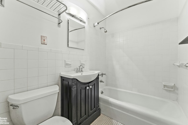 77 Fulton St Unit 9N, New York City, NY 10038 - full bathroom featuring vanity, tile walls, shower / bathtub combination, and tile patterned flooring