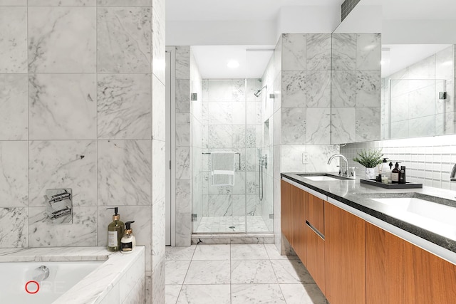 311 W Broadway Unit 3C, New York City, NY 10013 - full bath featuring a shower stall, double vanity, a garden tub, and tile walls
