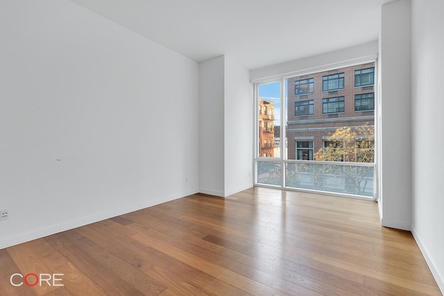 311 W Broadway Unit 3C, New York City, NY 10013 - spare room with hardwood / wood-style floors
