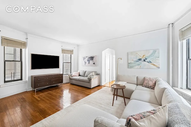 250 W 22nd St Unit 2C, New York City, NY 10011 - living area with hardwood / wood-style flooring and arched walkways