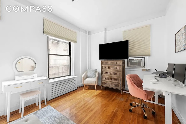 250 W 22nd St Unit 2C, New York City, NY 10011 - home office with wood finished floors and cooling unit
