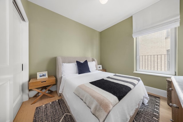 186 Clinton St Unit 4B, New York City, NY 11201 - bedroom with light wood finished floors and multiple windows