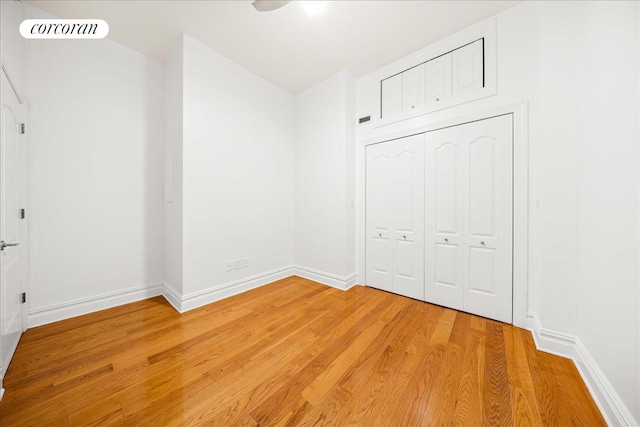 458 W 146th St Unit 2S, New York City, NY 10031 - unfurnished bedroom featuring light wood finished floors and a closet