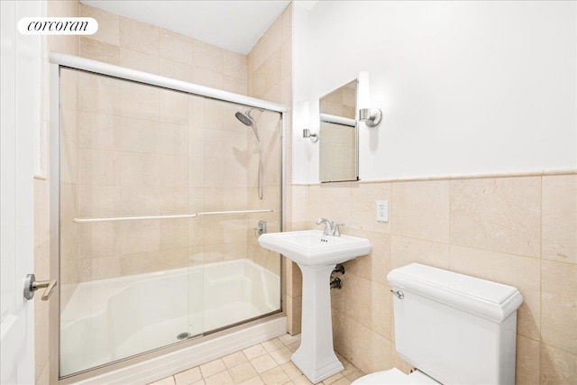 458 W 146th St Unit 2S, New York City, NY 10031 - bathroom with a shower stall and tile walls