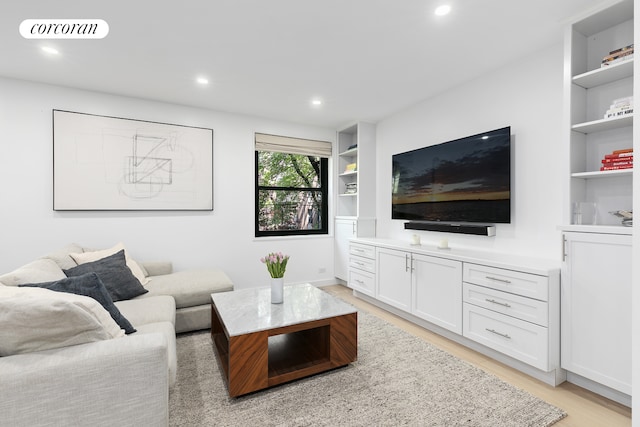 626 Washington St Unit 1B, New York City, NY 10014 - living area featuring light wood-type flooring, recessed lighting, and built in shelves
