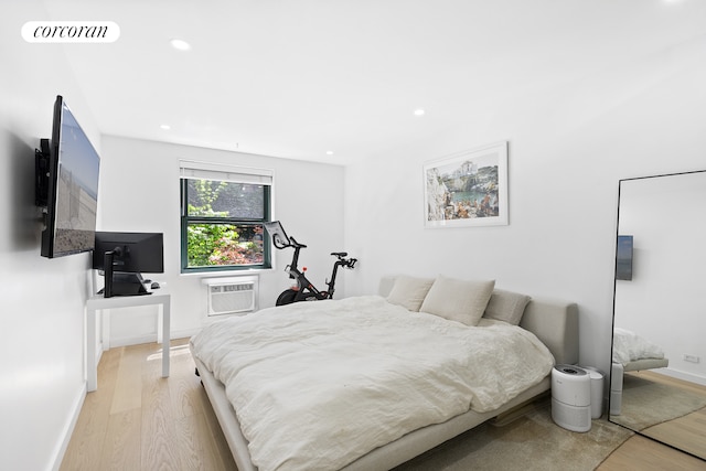 626 Washington St Unit 1B, New York City, NY 10014 - bedroom featuring light wood-style floors, recessed lighting, and a wall unit AC