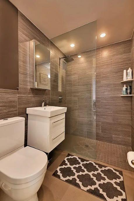 10 Park Ave Unit 26-S, New York City, NY 10016 - bathroom with vanity, tiled shower, tile walls, tile patterned flooring, and recessed lighting