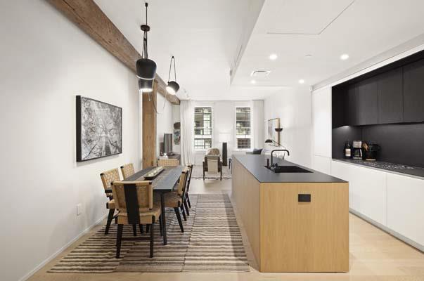 168 Plymouth St Unit 4-D, New York City, NY 11201 - kitchen featuring dark countertops, modern cabinets, a kitchen island with sink, recessed lighting, and white cabinets