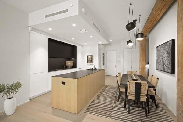 168 Plymouth St Unit 4-D, New York City, NY 11201 - kitchen featuring modern cabinets, a large island, light wood-type flooring, dark countertops, and recessed lighting