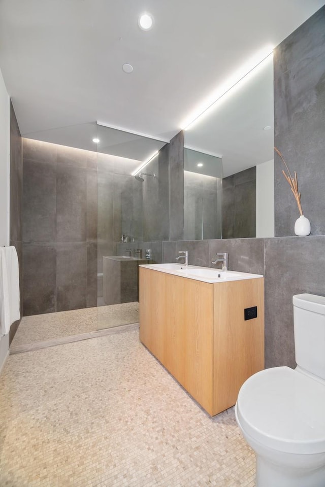 168 Plymouth St Unit 4-D, New York City, NY 11201 - full bath featuring tile walls, double vanity, a walk in shower, and recessed lighting
