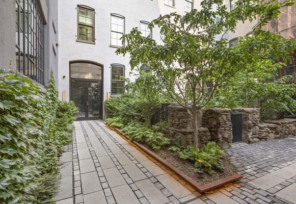 168 Plymouth St Unit 4-D, New York City, NY 11201 - doorway to property featuring stucco siding