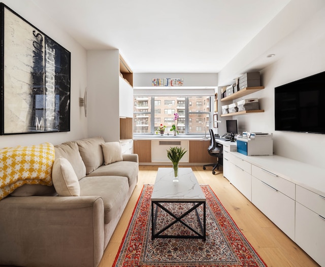 45 Sutton Pl S Unit 8H, New York City, NY 10022 - living area with built in desk and light wood finished floors