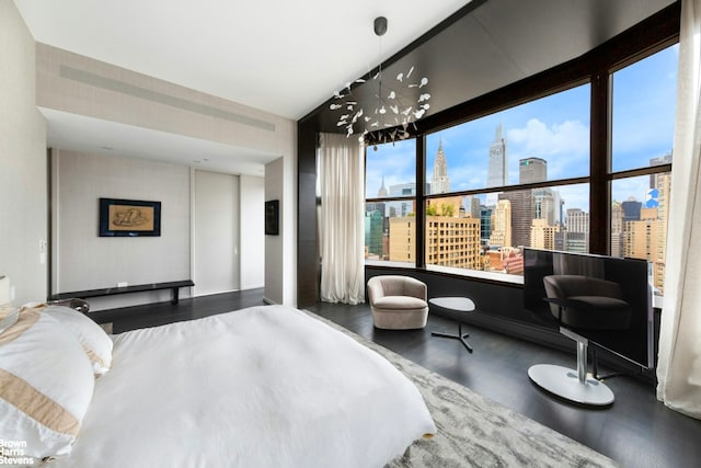 50 United Nations Plz Unit 28B, New York City, NY 10017 - bedroom with wood finished floors and a skyline view