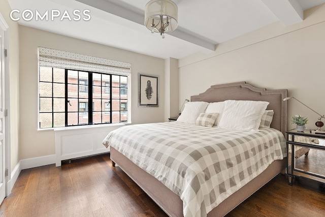 71 E 77th St Unit 8A, New York City, NY 10075 - bedroom with beam ceiling and dark wood-type flooring