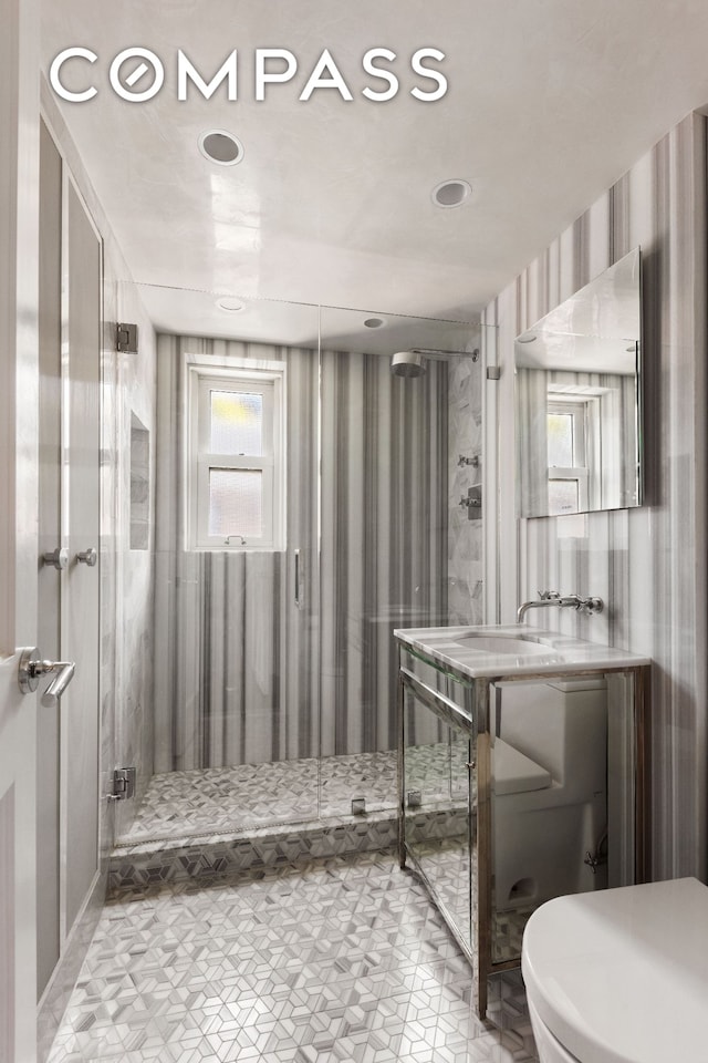 799 Park Ave Unit 17A, New York City, NY 10021 - bathroom with vanity, wallpapered walls, recessed lighting, and a shower stall