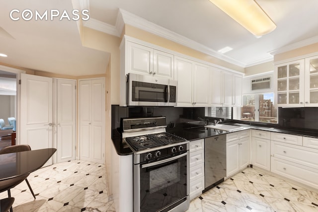 799 Park Ave Unit 17A, New York City, NY 10021 - kitchen with appliances with stainless steel finishes, ornamental molding, white cabinetry, dark countertops, and a wall mounted AC