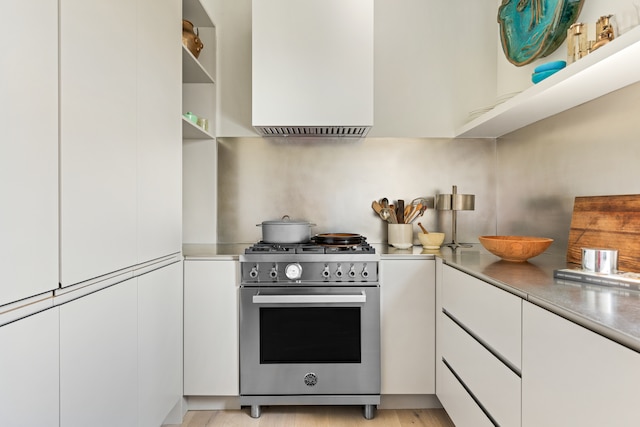 150 Joralemon St Unit 7G, New York City, NY 11201 - kitchen with high end range, white cabinets, open shelves, extractor fan, and stainless steel counters