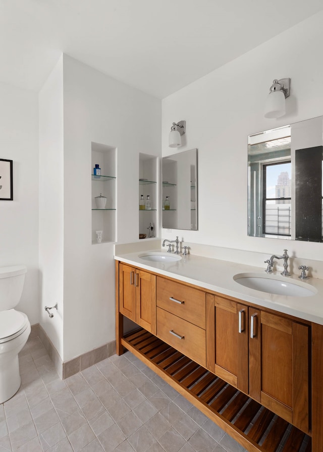 300 E 74th St Unit 23G, New York City, NY 10021 - full bath with double vanity and tile patterned flooring
