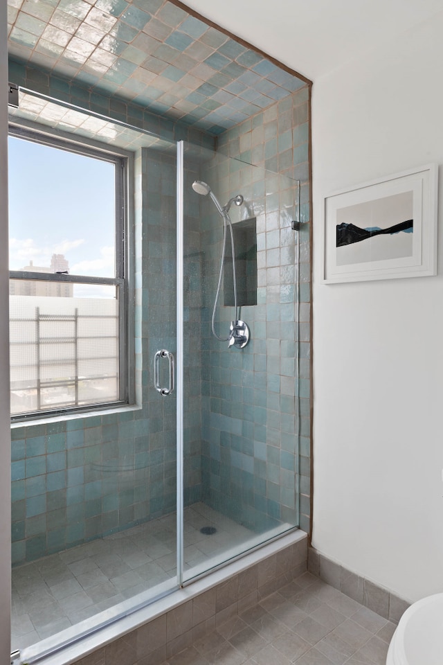 300 E 74th St Unit 23G, New York City, NY 10021 - full bathroom with a shower stall and tile patterned floors
