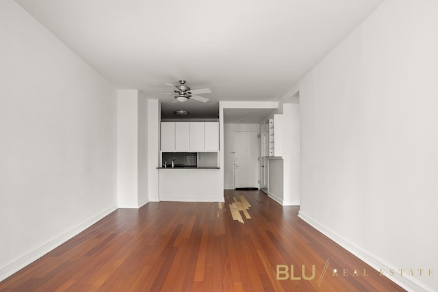 100 Riverside Blvd Unit 8-T, New York City, NY 10069 - unfurnished living room with dark wood-type flooring and ceiling fan