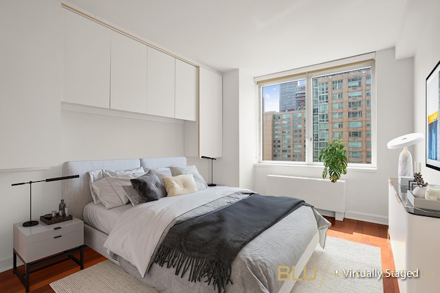100 Riverside Blvd Unit 8-T, New York City, NY 10069 - bedroom featuring radiator and light wood-type flooring