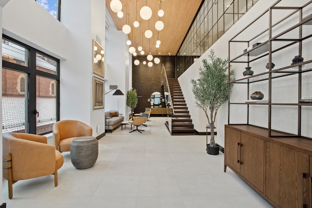 400 E 67th St Unit 20B, New York City, NY 10065 - building lobby featuring a high ceiling, wooden ceiling, and stairway