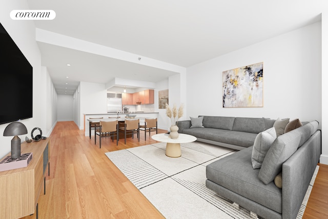 125 W 22nd St Unit 9B, New York City, NY 10011 - living room featuring light wood-style flooring and recessed lighting