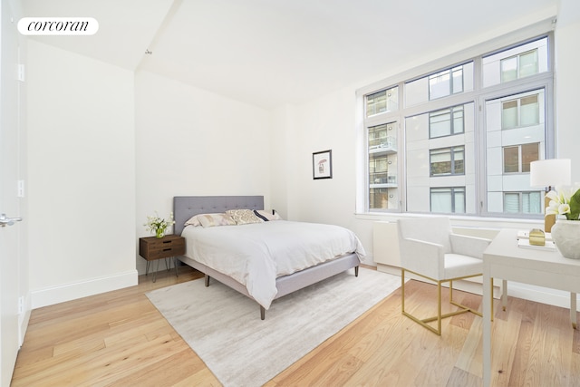 125 W 22nd St Unit 9B, New York City, NY 10011 - bedroom featuring wood finished floors and baseboards