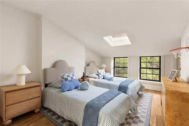 384 Hancock St, New York City, NY 11216 - bedroom with a skylight, wood finished floors, and lofted ceiling