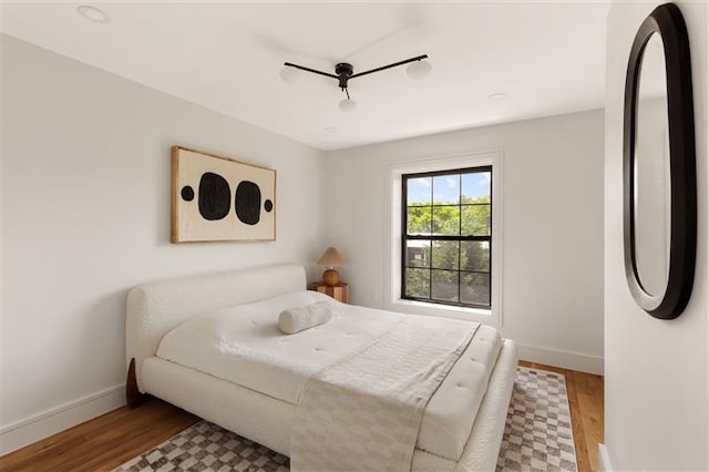 384 Hancock St, New York City, NY 11216 - bedroom featuring wood finished floors and ceiling fan