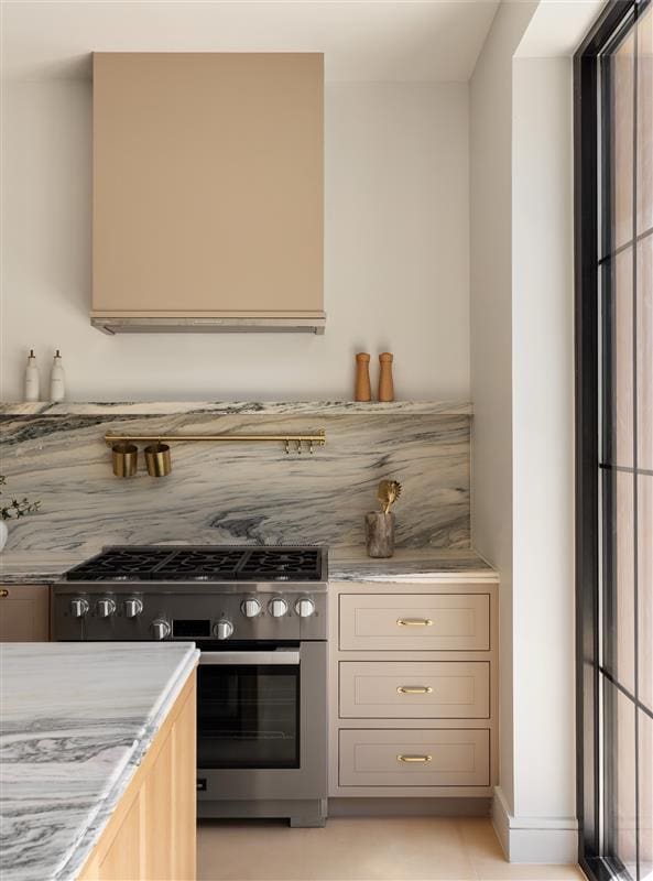 384 Hancock St, New York City, NY 11216 - kitchen with stainless steel range with gas stovetop and light stone counters