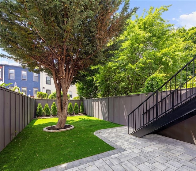 384 Hancock St, New York City, NY 11216 - fenced backyard featuring a patio