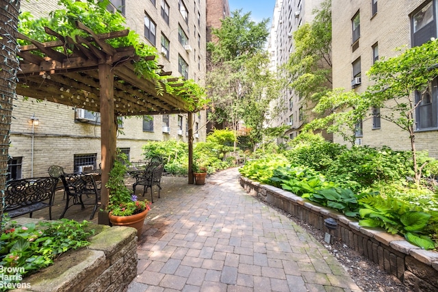433 E 51st St Unit 11E, New York City, NY 10022 - view of home's community with a pergola and a patio area