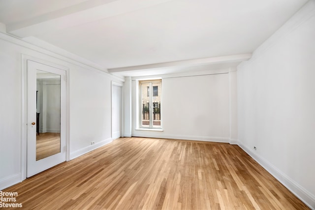 433 E 51st St Unit 11E, New York City, NY 10022 - spare room with light wood-type flooring and baseboards