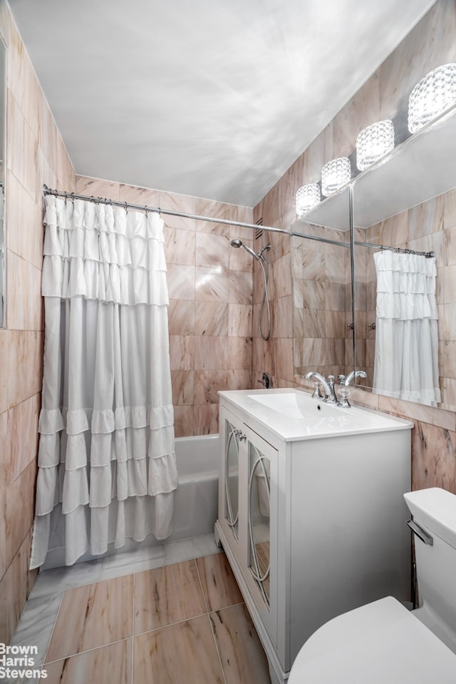 111 E 85th St Unit 9G, New York City, NY 10028 - bathroom with tile walls, shower / tub combo, and vanity