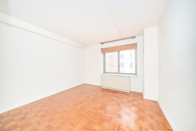 300 W 135th St Unit 4L, New York City, NY 10030 - empty room featuring radiator heating unit and baseboards