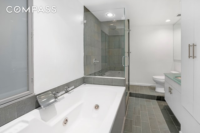 415 W 55th St Unit 4D, New York City, NY 10019 - bathroom with vanity, a stall shower, a jetted tub, recessed lighting, and tile patterned flooring