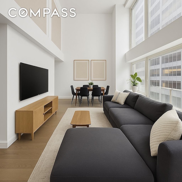 67 Liberty St Unit 10, New York City, NY 10005 - living area featuring a high ceiling and wood finished floors