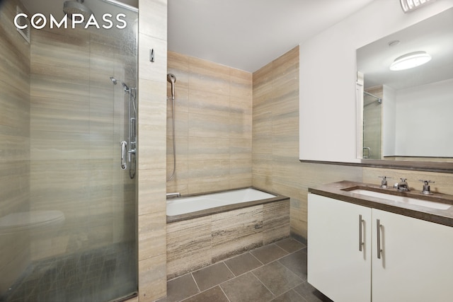 67 Liberty St Unit 10, New York City, NY 10005 - full bathroom featuring a shower stall, tiled tub, vanity, and tile patterned floors