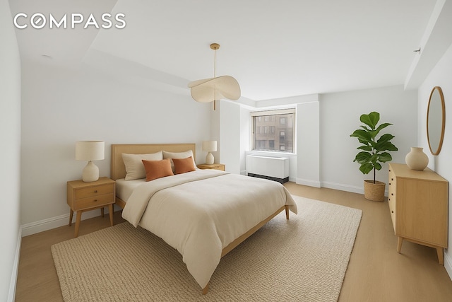 67 Liberty St Unit 10, New York City, NY 10005 - bedroom featuring light wood finished floors and baseboards