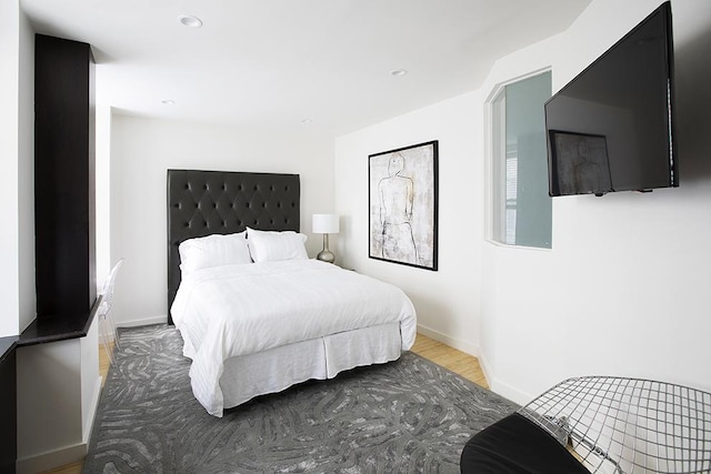 150 W 51st St Unit 1623, New York City, NY 10019 - bedroom featuring wood finished floors and recessed lighting