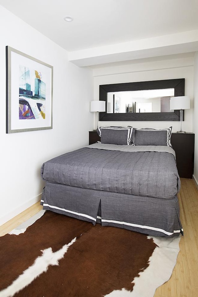 150 W 51st St Unit 1623, New York City, NY 10019 - bedroom featuring wood finished floors and baseboards