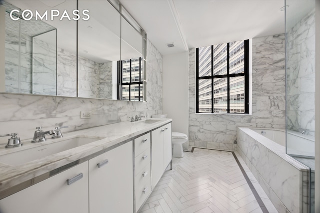 100 Barclay St Unit 15B, New York City, NY 10007 - bathroom featuring double vanity, a bath, and tile walls
