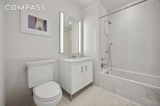 100 Barclay St Unit 15B, New York City, NY 10007 - bathroom with vanity, tiled shower / bath, tile walls, and tile patterned flooring