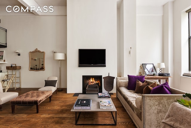377 W 11th St Unit 3A, New York City, NY 10014 - living room featuring a fireplace with flush hearth and dark wood-type flooring