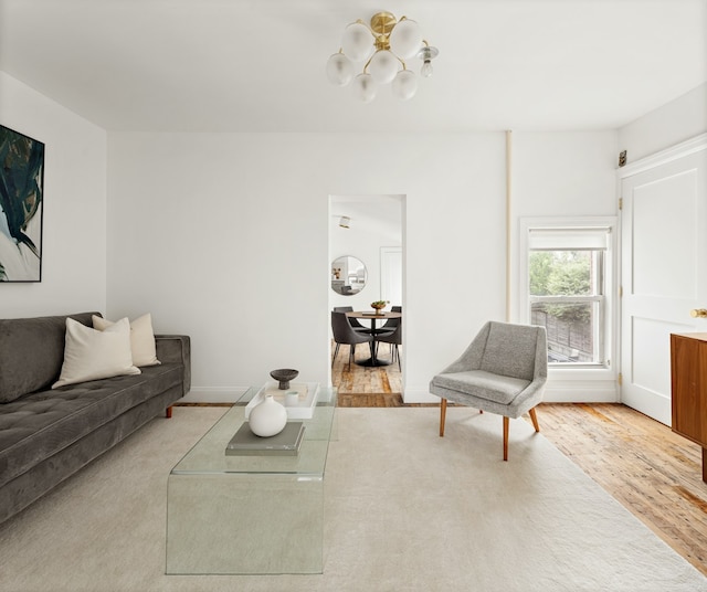 211 Powers St, New York City, NY 11211 - living area with a chandelier and wood finished floors