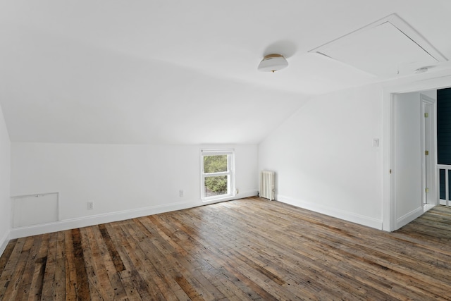 211 Powers St, New York City, NY 11211 - bonus room with radiator, lofted ceiling, hardwood / wood-style floors, and attic access