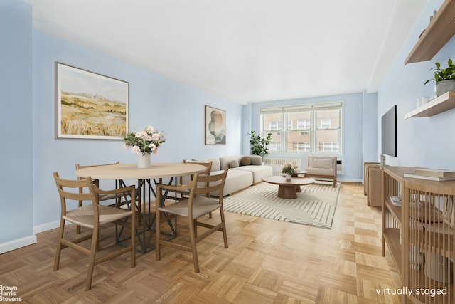 160 E 27th St Unit 11E, New York City, NY 10016 - dining room with radiator and baseboards