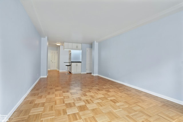 160 E 27th St Unit 11E, New York City, NY 10016 - unfurnished living room with baseboards