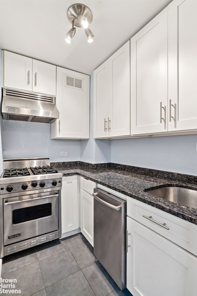 160 E 27th St Unit 11E, New York City, NY 10016 - kitchen featuring under cabinet range hood, stainless steel appliances, and white cabinetry